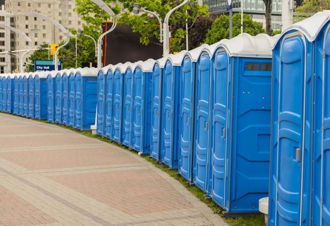 a row of portable restrooms at an outdoor special event, ready for use in Maitland